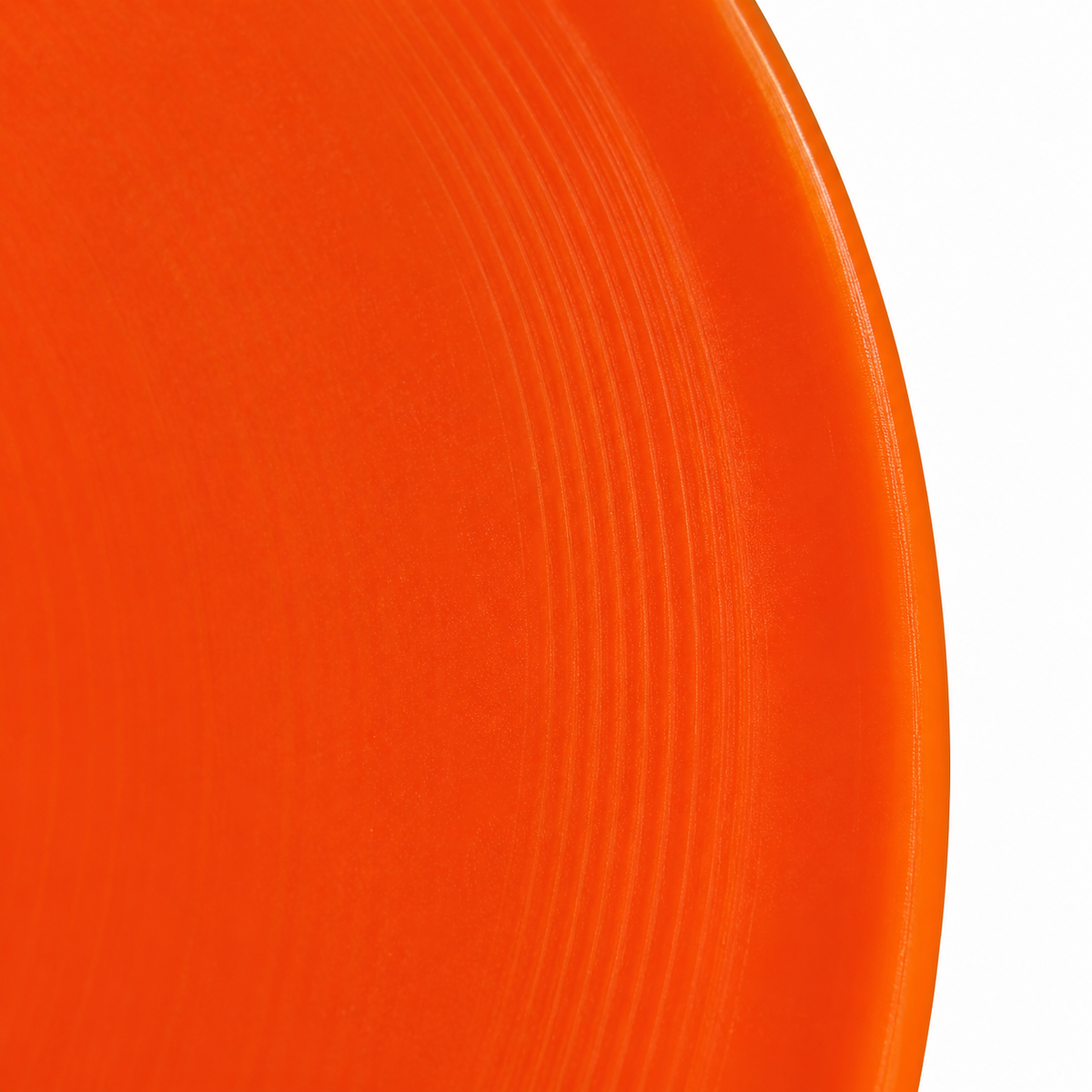 Flying disc — actual plain orange grip rim partial detail