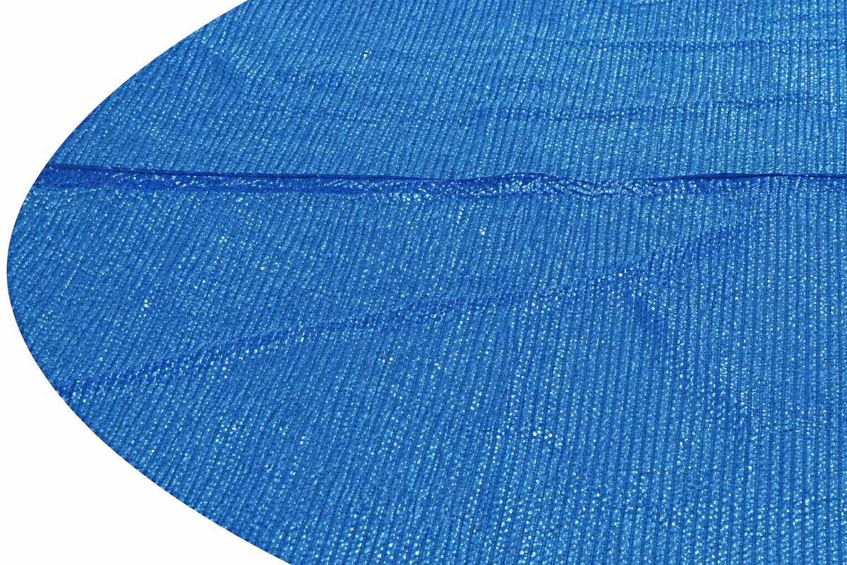 Solar pool cover — actual PE texture, seam and left-edge detail